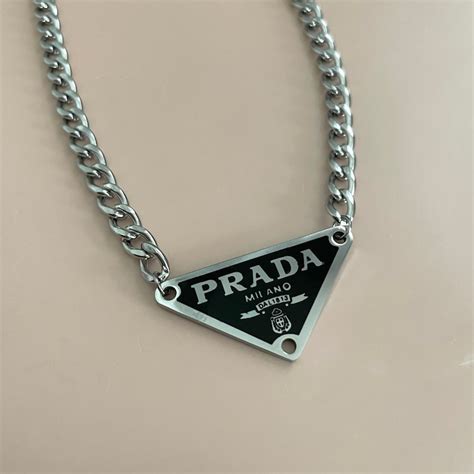 triangle prada necklace|necklace with triangle pendant.